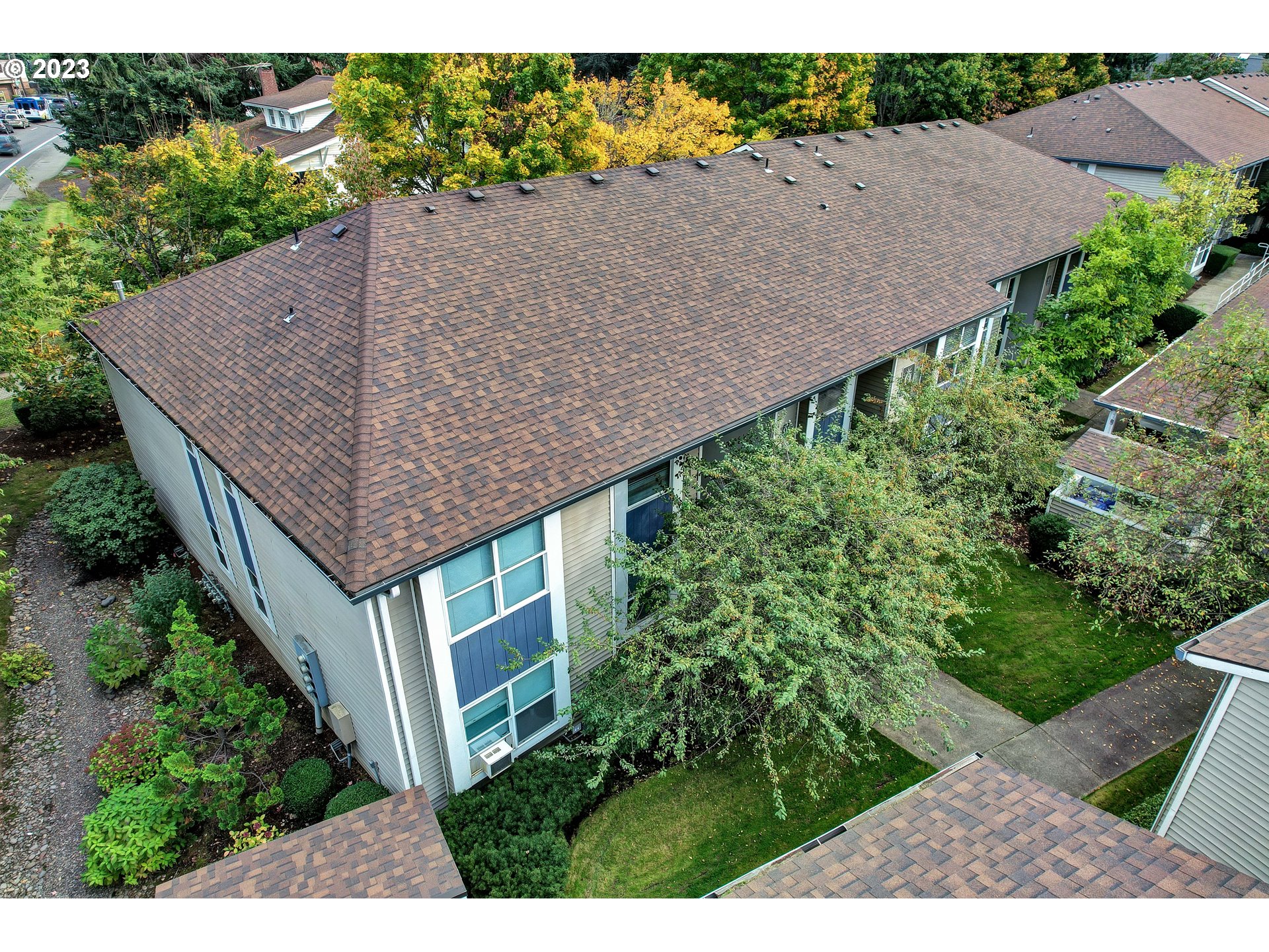 4694 West Powell Boulevard, Unit 139 Gresham, OR 97030 - Photo 3 of 29 an aerial view of a house with a yard and potted plants