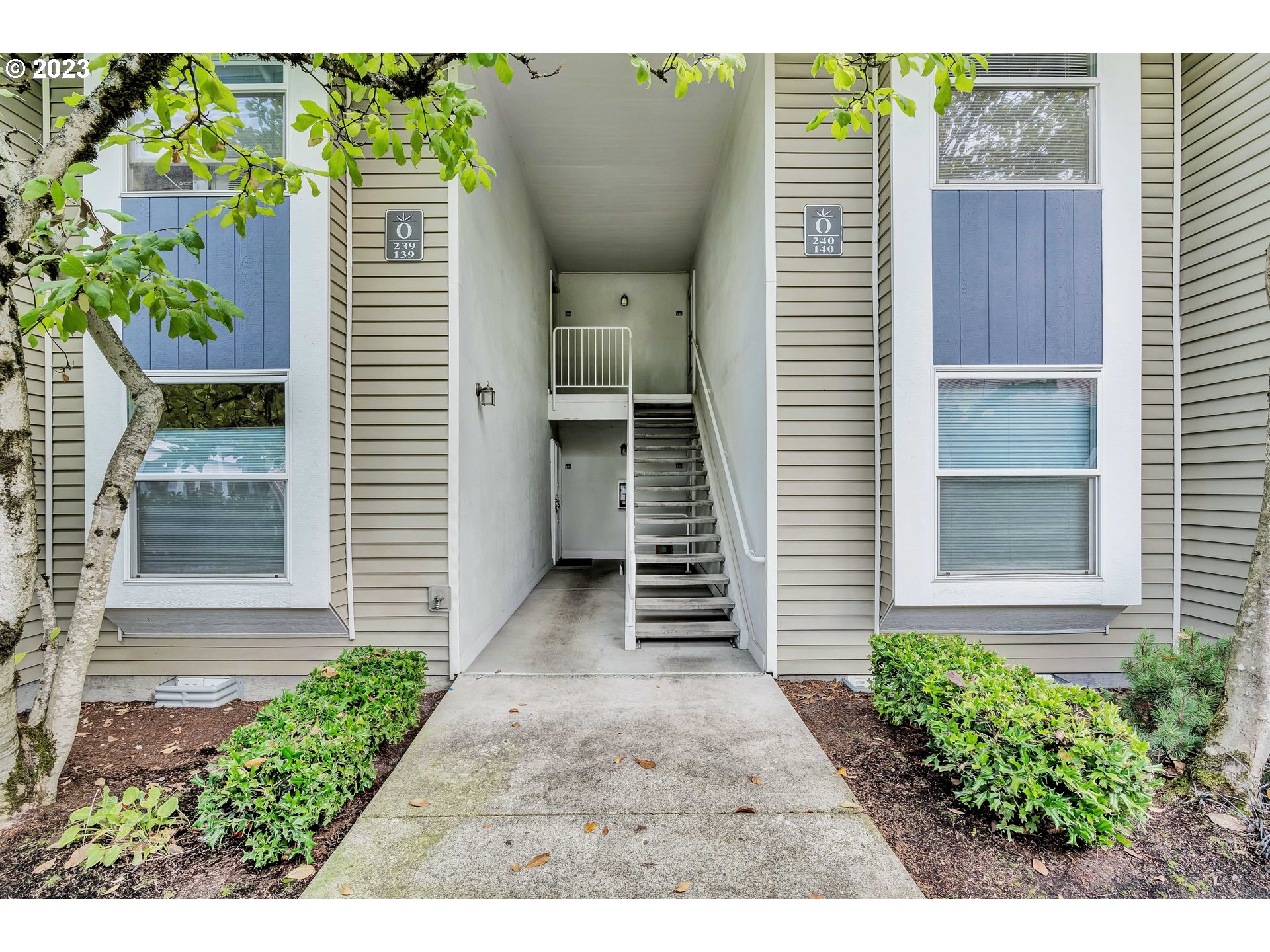4694 West Powell Boulevard, Unit 139 Gresham, OR 97030 - Photo 4 of 29 a backyard of a house with plants and outdoor seating