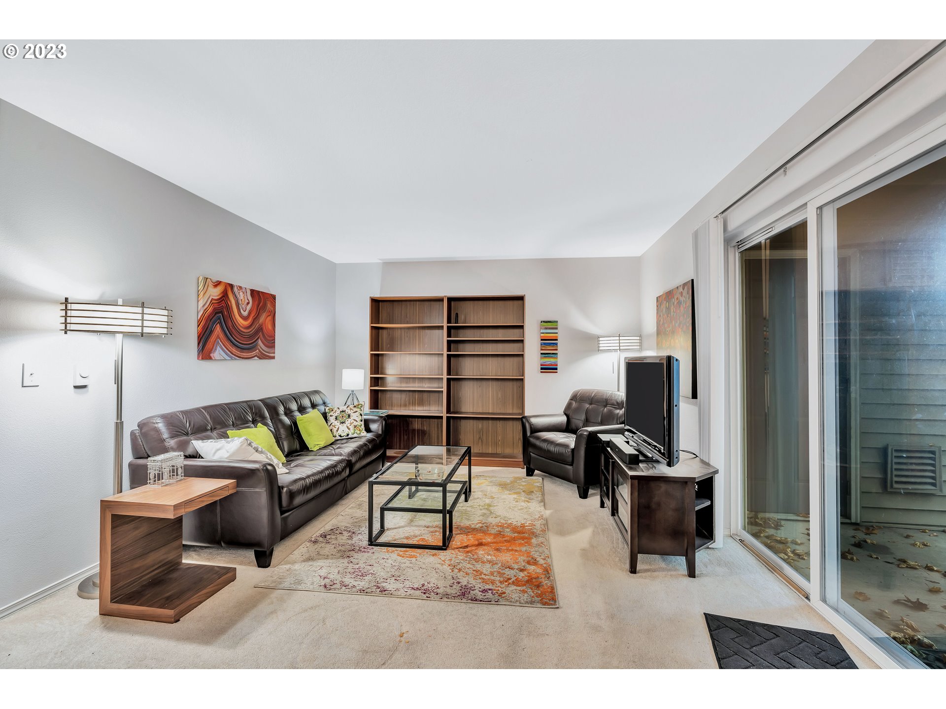 4694 West Powell Boulevard, Unit 139 Gresham, OR 97030 - Photo 8 of 29 a living room with furniture and a flat screen tv