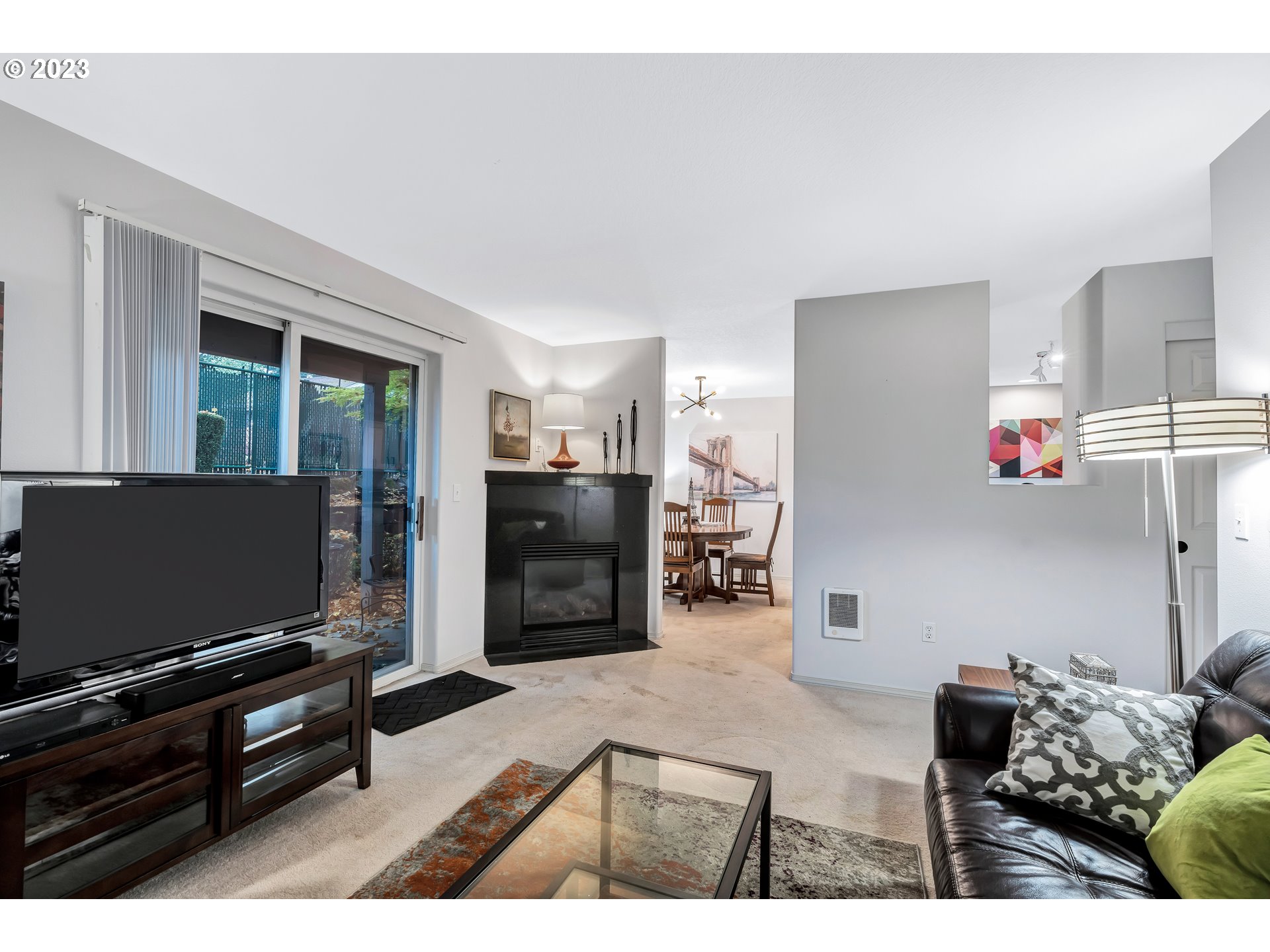 4694 West Powell Boulevard, Unit 139 Gresham, OR 97030 - Photo 9 of 29 a living room with furniture and a flat screen tv