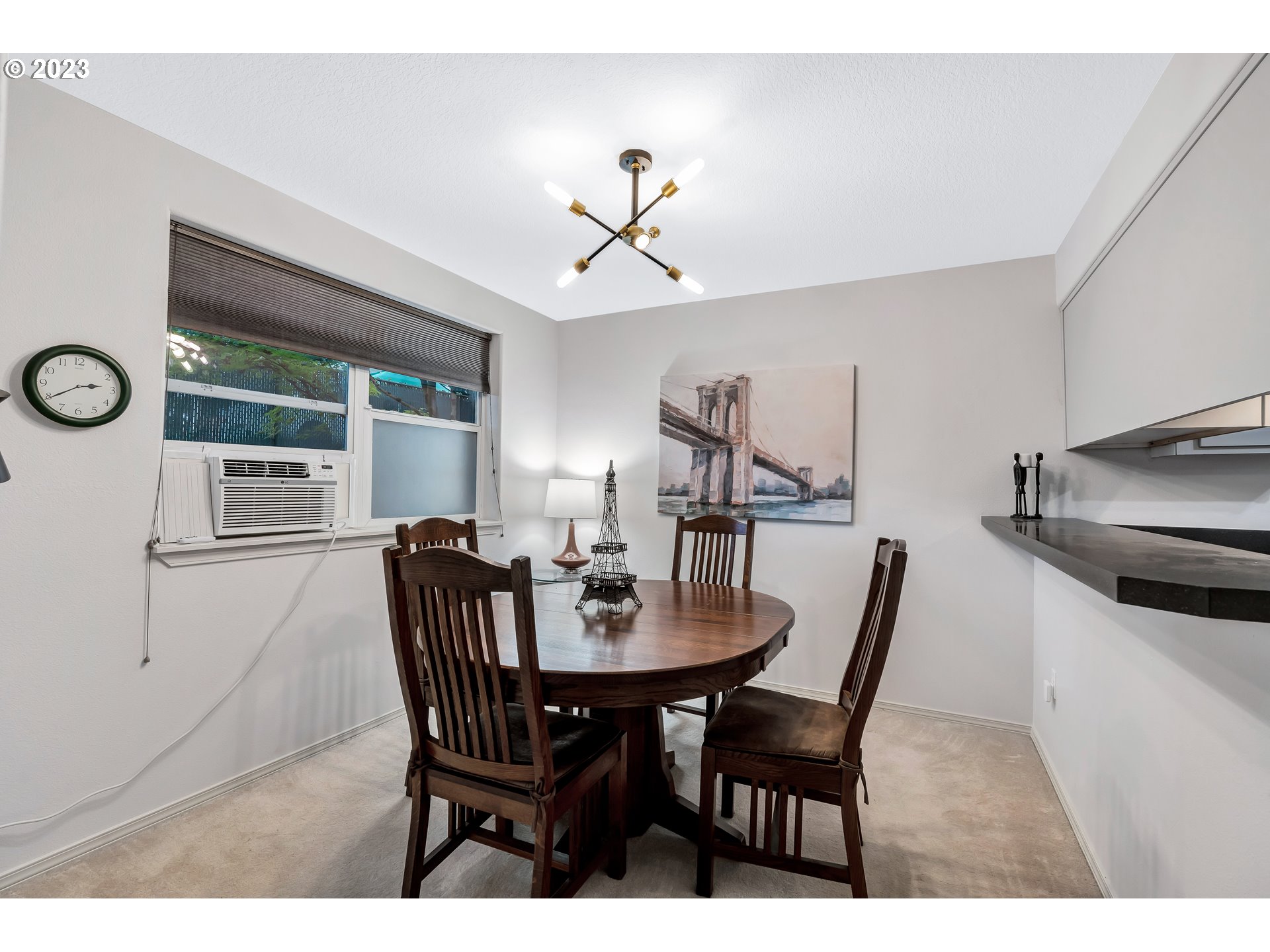 4694 West Powell Boulevard, Unit 139 Gresham, OR 97030 - Photo 10 of 29 a view of a dining room with furniture and window