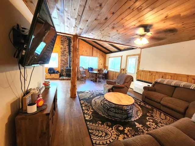 a bed room with a bed and a chair