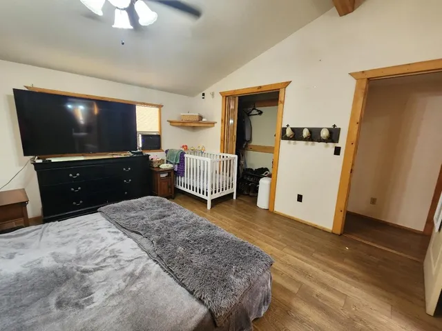 a bathroom with a sink a toilet and shower curtain