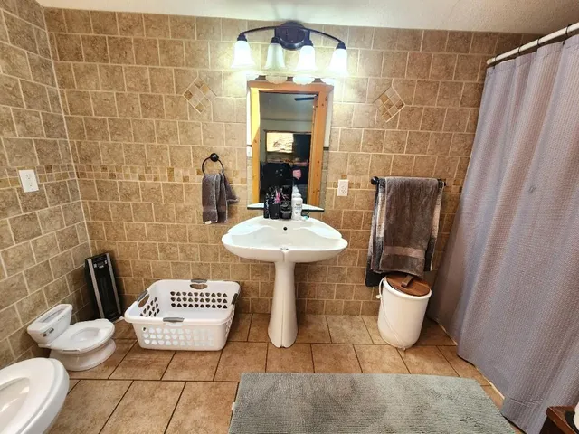 a view of washer and dryer in a bathroom