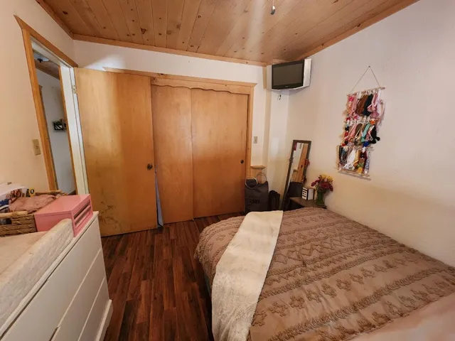 a view of deck with wooden floor and outdoor seating
