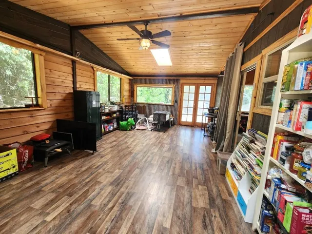 a view of a backyard with plants and a patio