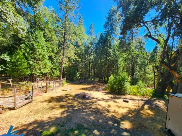 a backyard of a house with lots of green space
