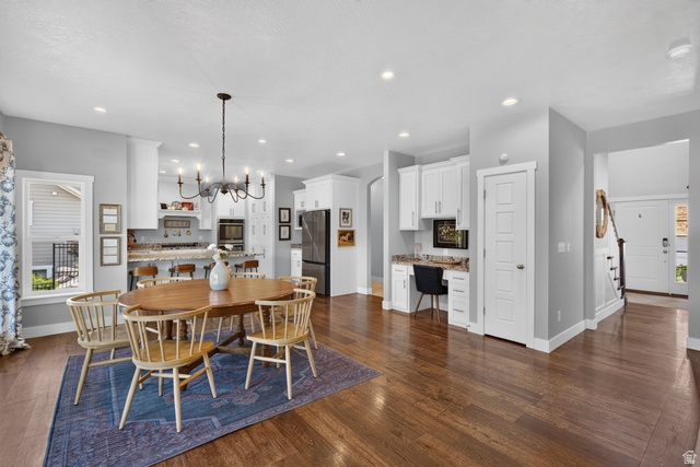 1263 East 1200th South Springville, UT 84663 - Photo 5 of 60 Hardwood-finish flooring throughout, featuring a kitchen with white cabinetry, stainless steel appliances, and a built-in desk area
