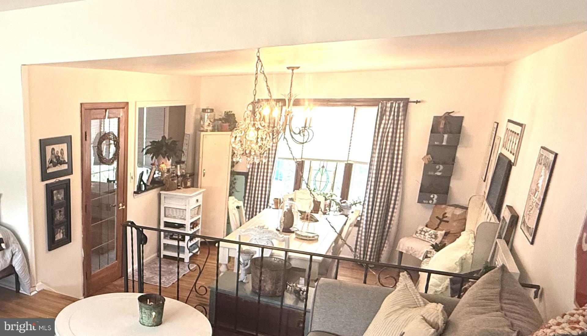 18 Wolfpack Road Hamilton, NJ 08619 - Photo 3 of 21 a dining room with furniture a chandelier and wooden floor