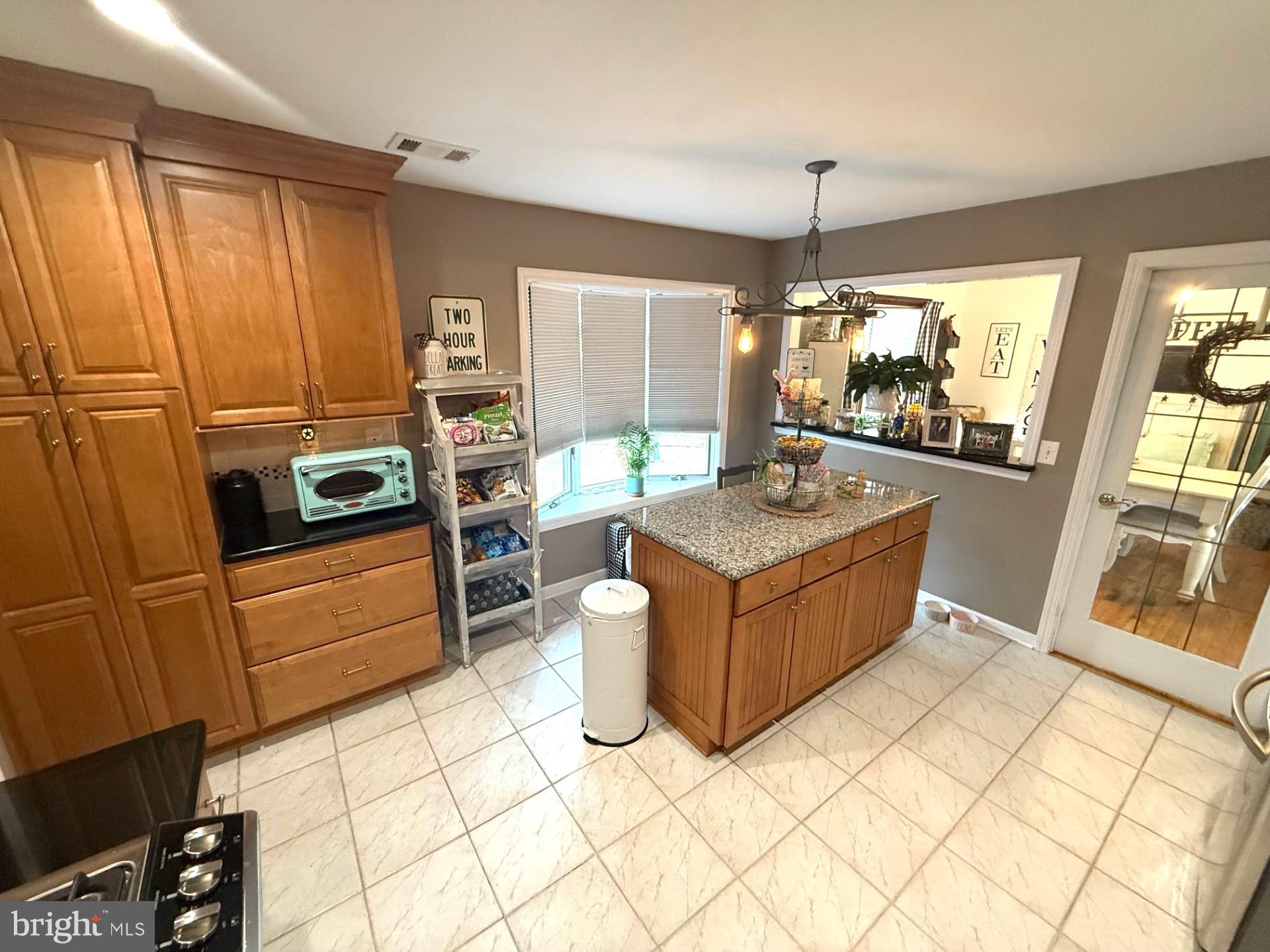 18 Wolfpack Road Hamilton, NJ 08619 - Photo 5 of 21 a kitchen with a sink stove and cabinets