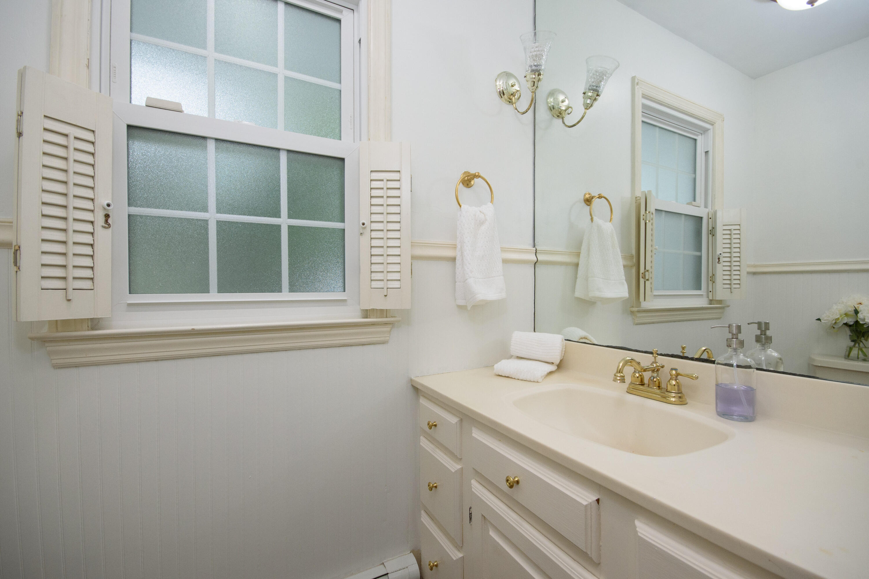 2 Red Barn Road Darien, CT 06820 - Photo 14 of 36 a bathroom with a sink and a mirror