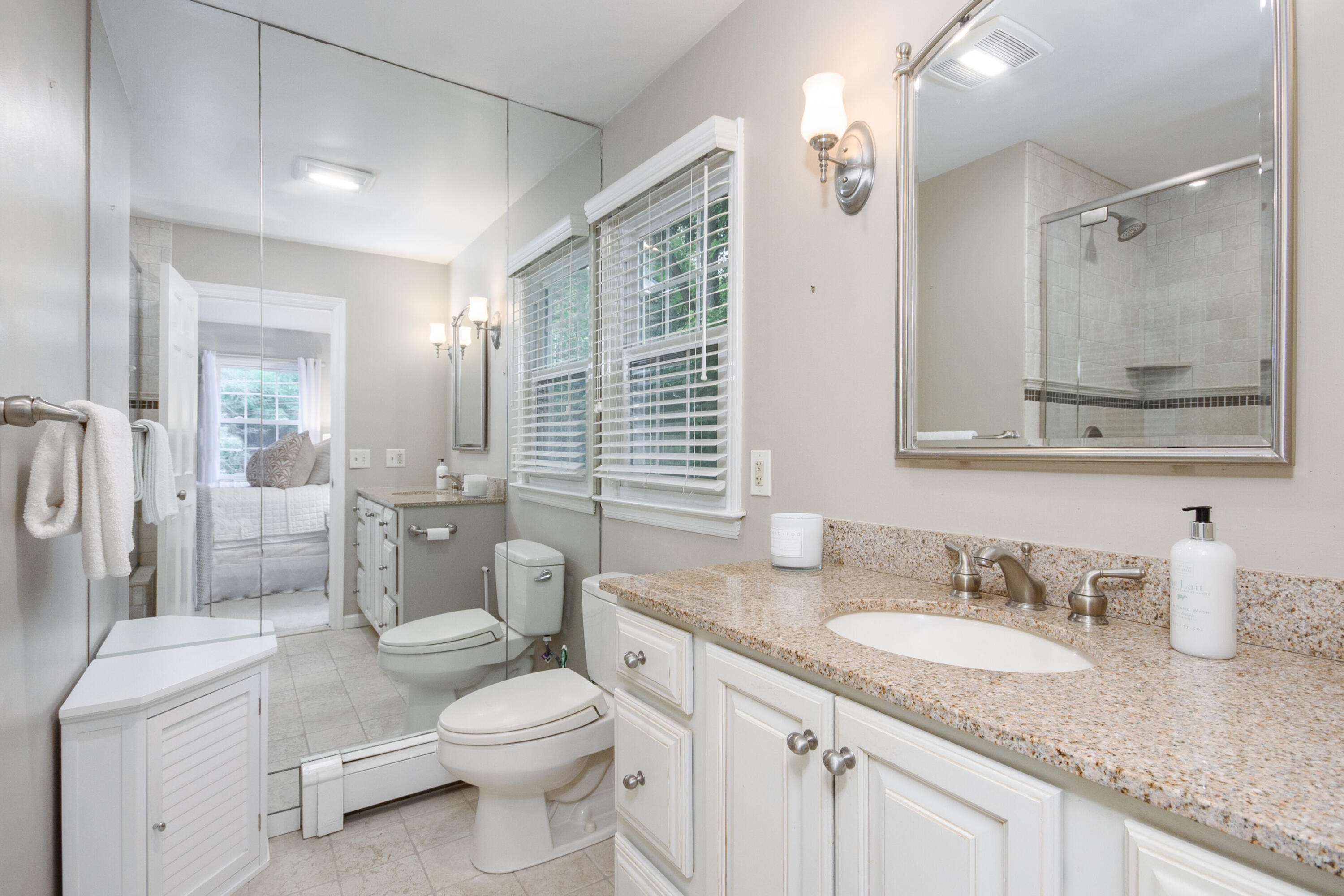 2 Red Barn Road Darien, CT 06820 - Photo 16 of 36 a bathroom with a granite countertop sink mirror vanity and toilet