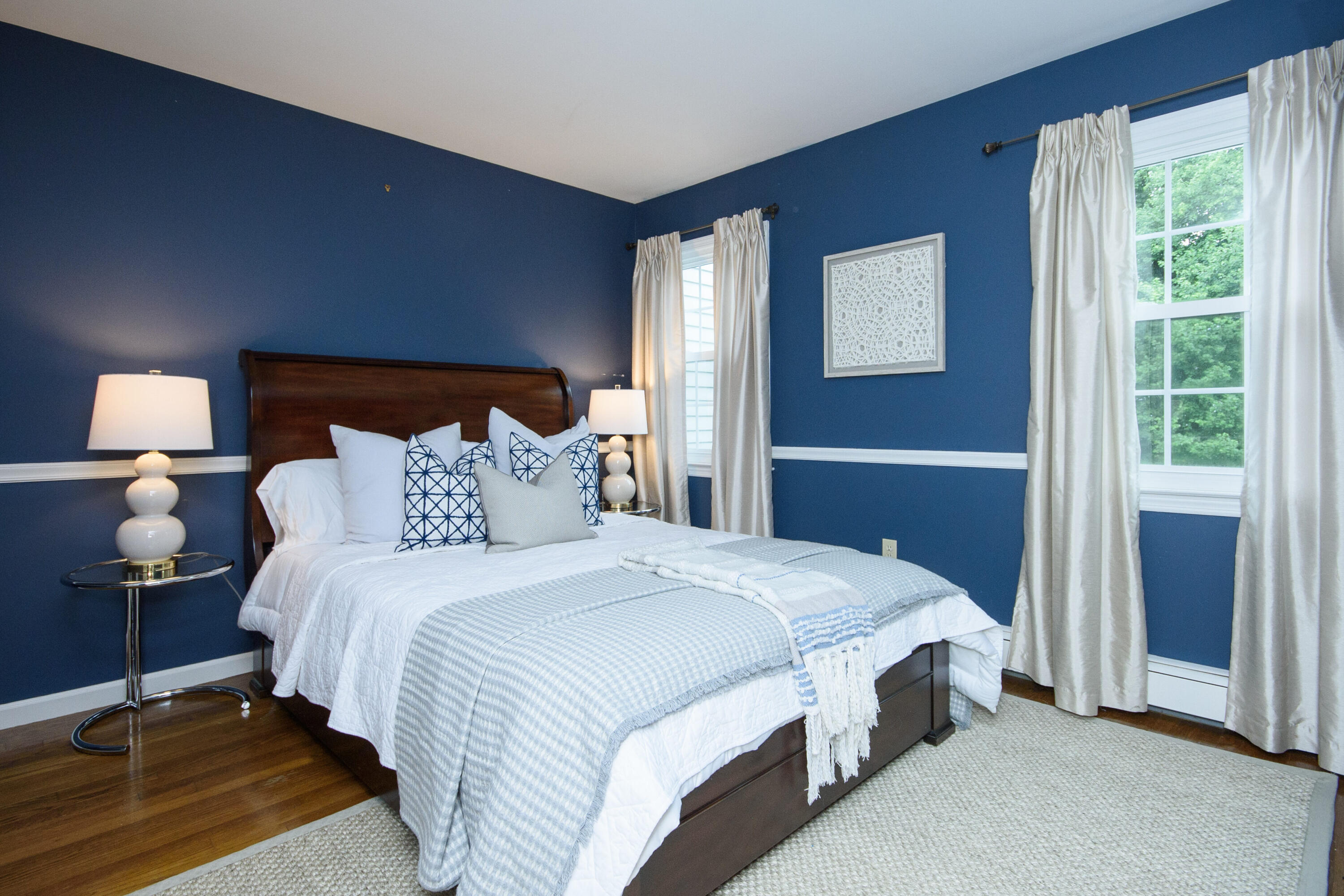 2 Red Barn Road Darien, CT 06820 - Photo 18 of 36 a bedroom with a bed and a lamp