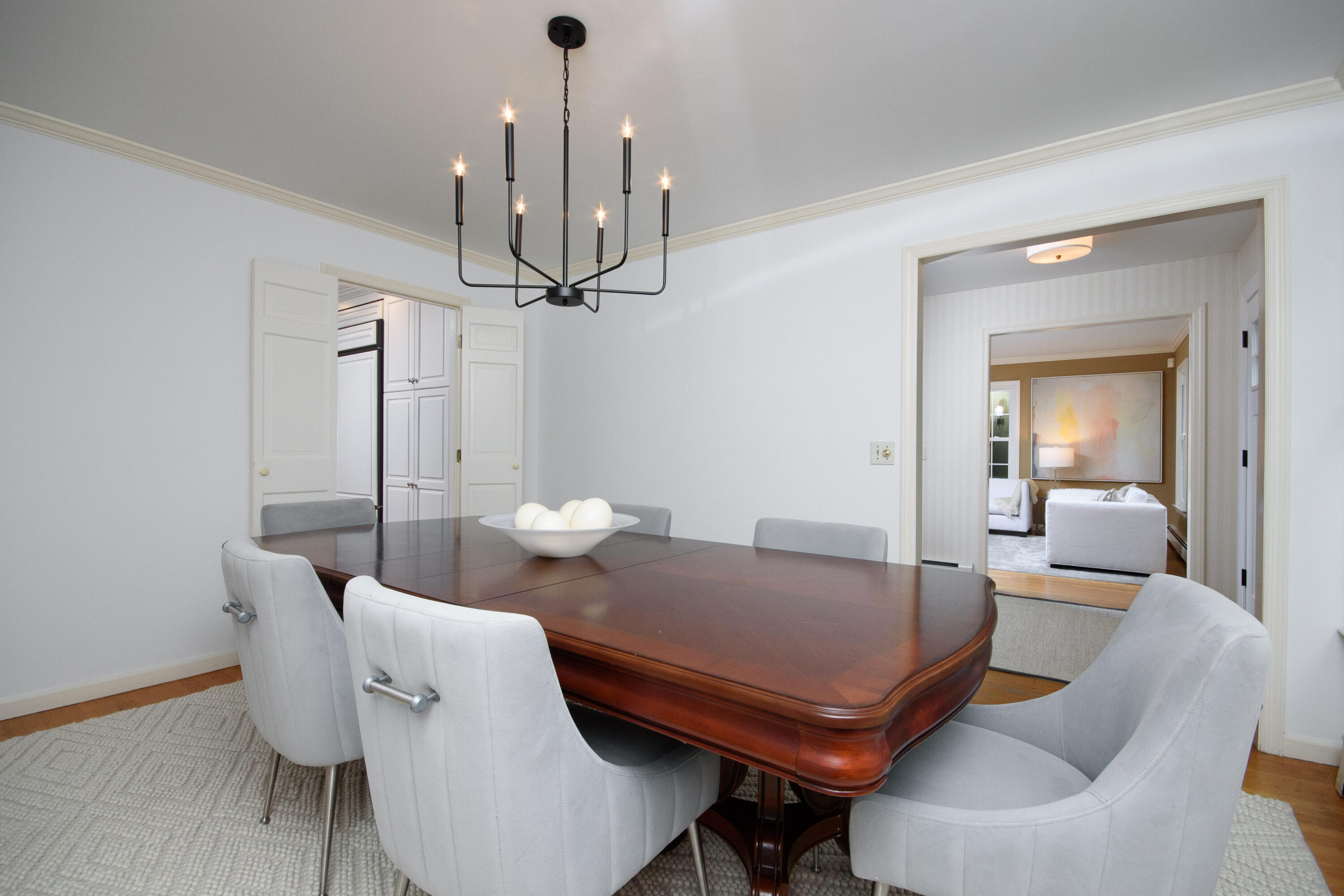 2 Red Barn Road Darien, CT 06820 - Photo 6 of 36 a living room with furniture and a chandelier