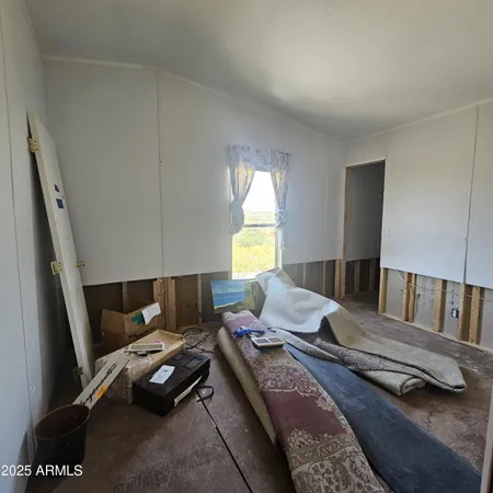 a living room with a couch and a window