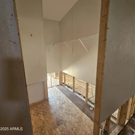 a view of a livingroom with a dishwasher and cabinets