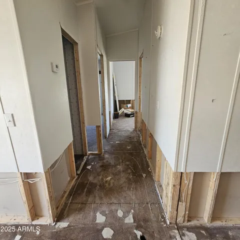 a view of a hallway with furniture