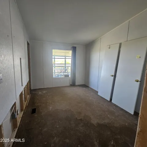 a view of empty room with front door