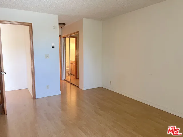 a view of a bathroom with a toilet and a shower