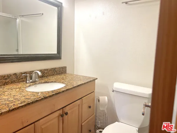 a view of a swimming pool and lounge chair