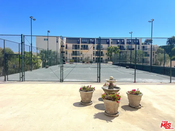 a view of a tree in front of a house