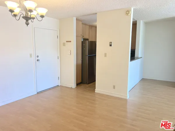 a view of a chandelier in an empty room