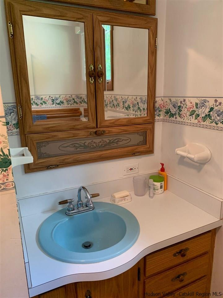 72 Union Center Road Ulster Park, NY 12487 - Photo 6 of 11 a bathroom with a sink and a window