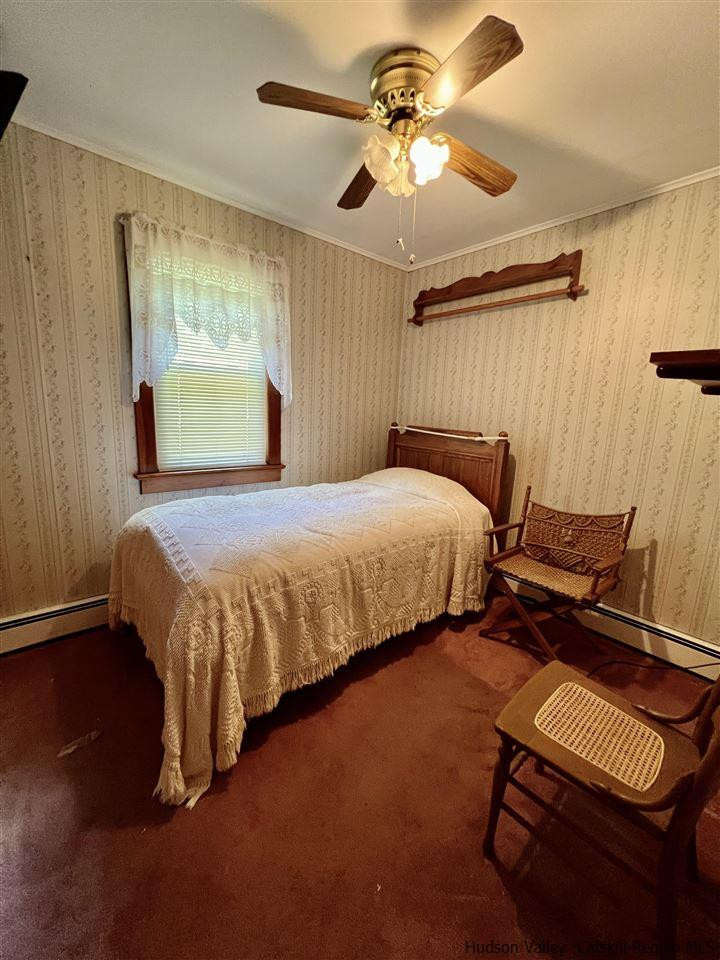 72 Union Center Road Ulster Park, NY 12487 - Photo 9 of 11 a bedroom with a bed furniture and a window