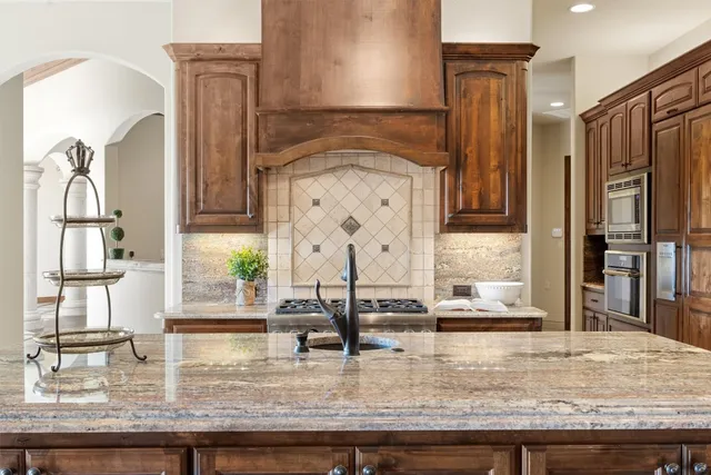 a kitchen with sink refrigerator and window