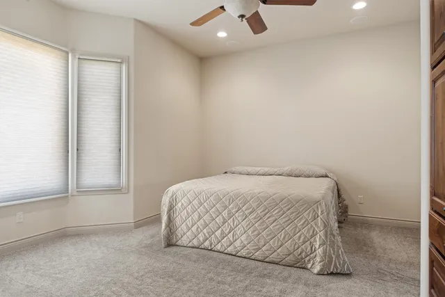 a room with a bed and a window