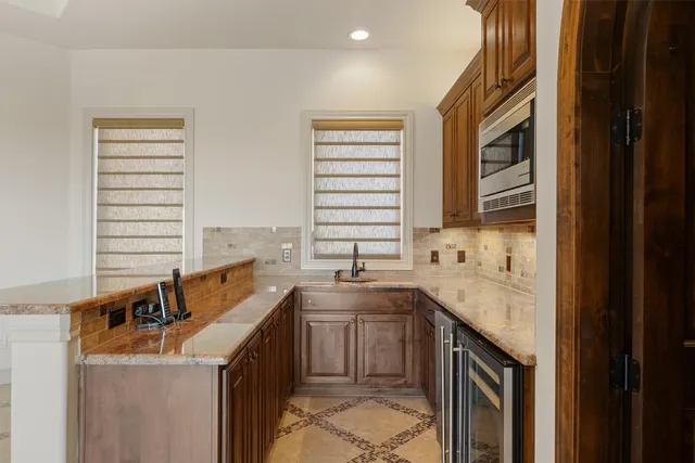 a kitchen that has a sink and a stove