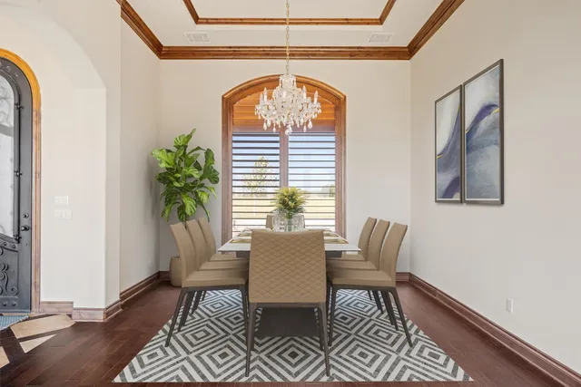 a dining room with furniture and wooden floor