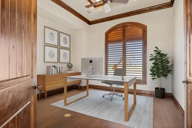 a living room with furniture and potted plants