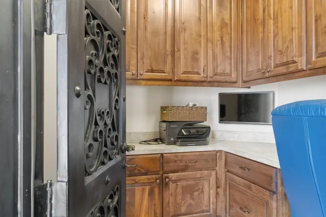 a kitchen with a refrigerator and cabinets