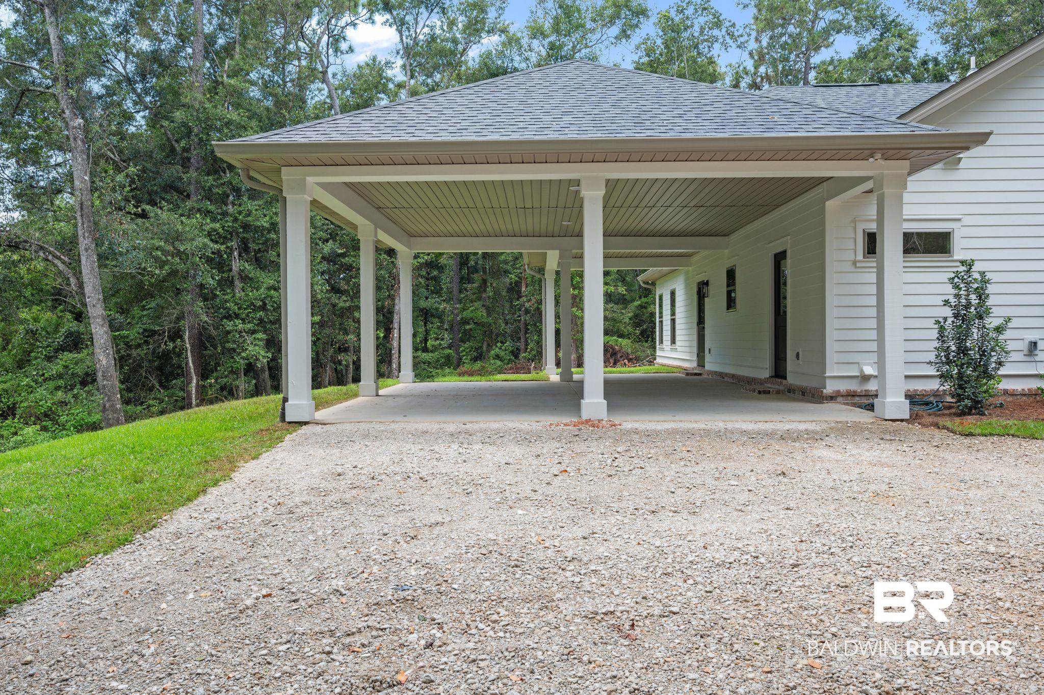 12412 Mannich Lane Foley, AL 36535 - Photo 20 of 23 View of car parking featuring a carport