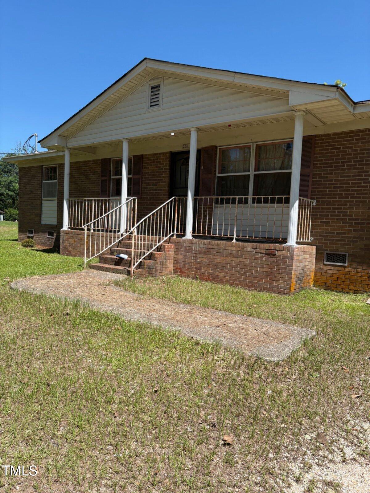 2001 Carr Creek Road Sanford, NC 27332 - Photo 2 of 5 a front view of a house with a yard