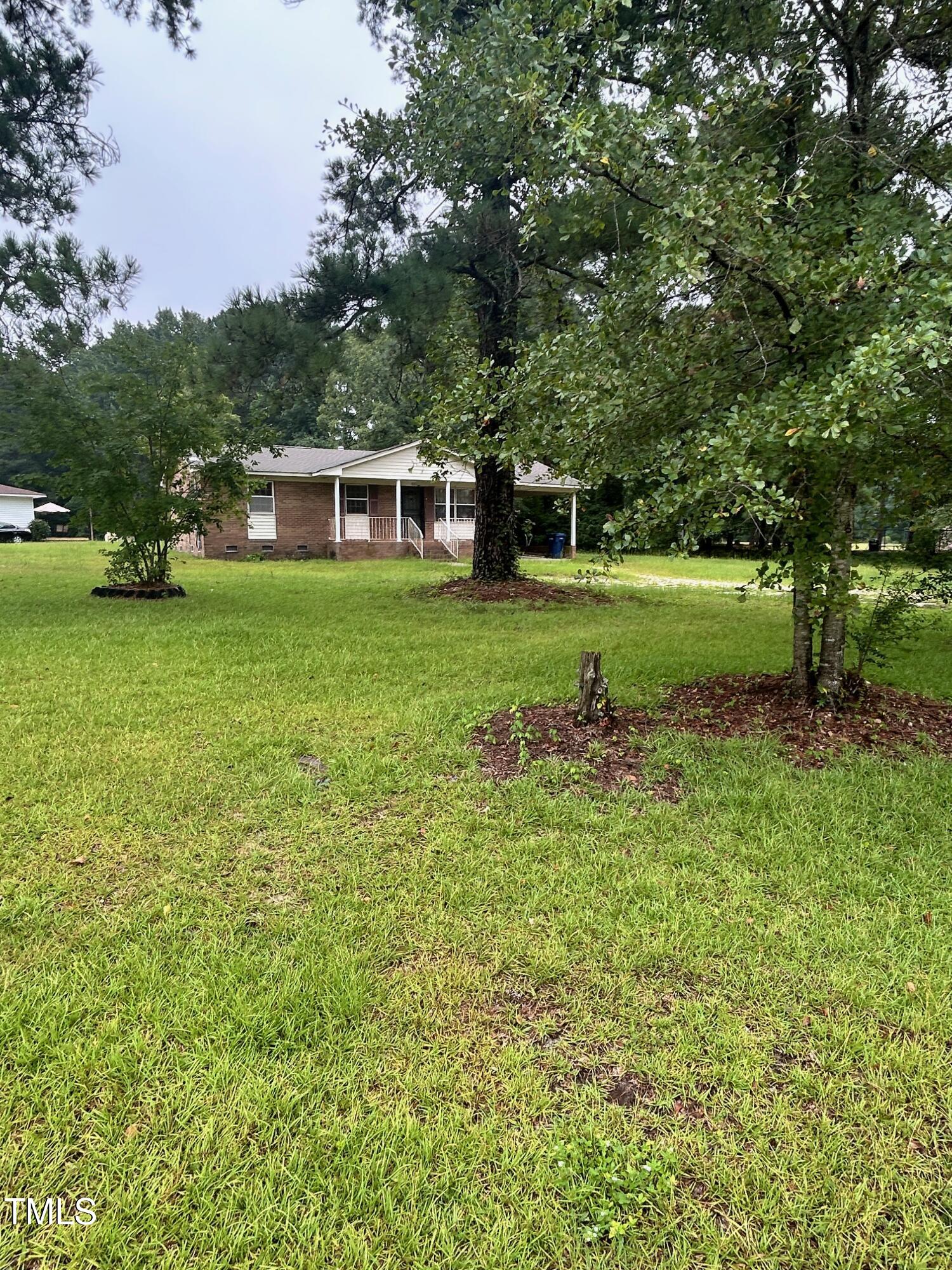 2001 Carr Creek Road Sanford, NC 27332 - Photo 3 of 5 a front view of a house with garden