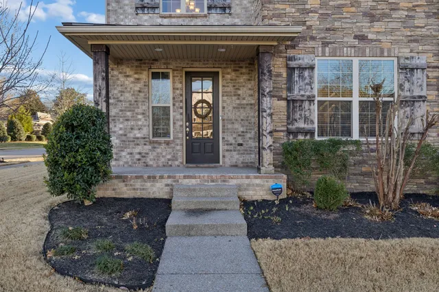 a building with potted plants in front of it
