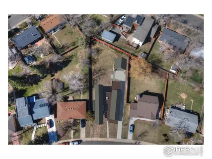 a aerial view of a house with a yard