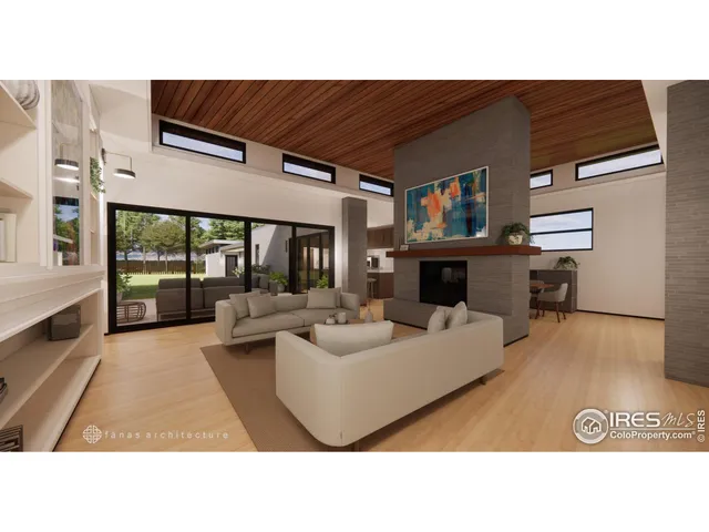 a living room with furniture a large window and a fireplace