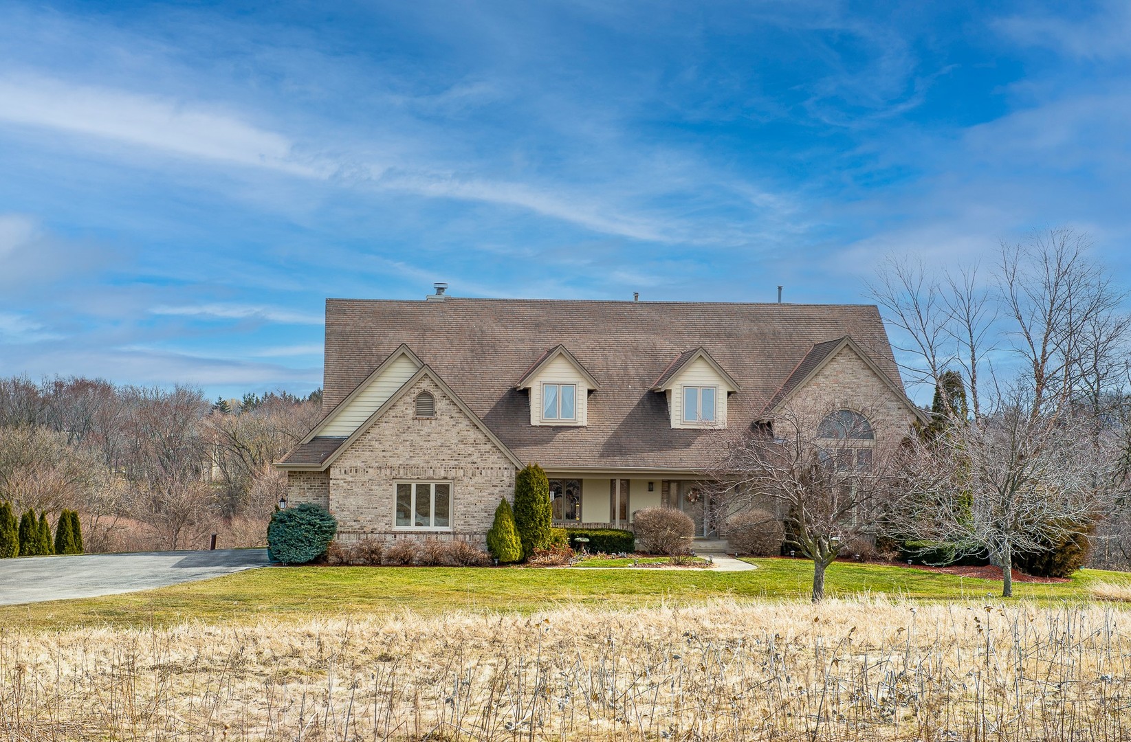 5229 State Road 38 Caledonia, WI 53126 - Photo 1 of 1 a view of a house with a big yard and large trees