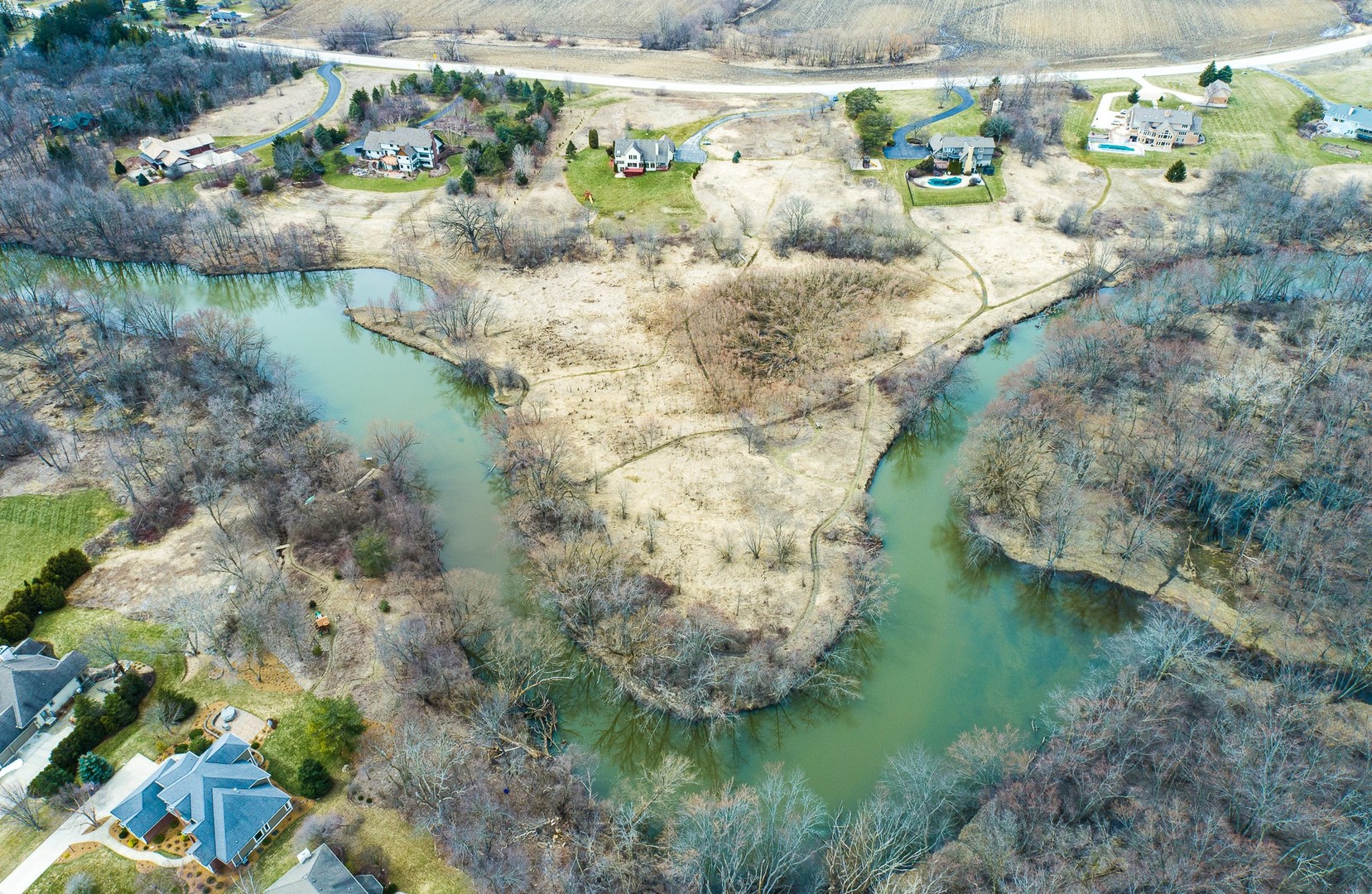 a view of a lake with a yard