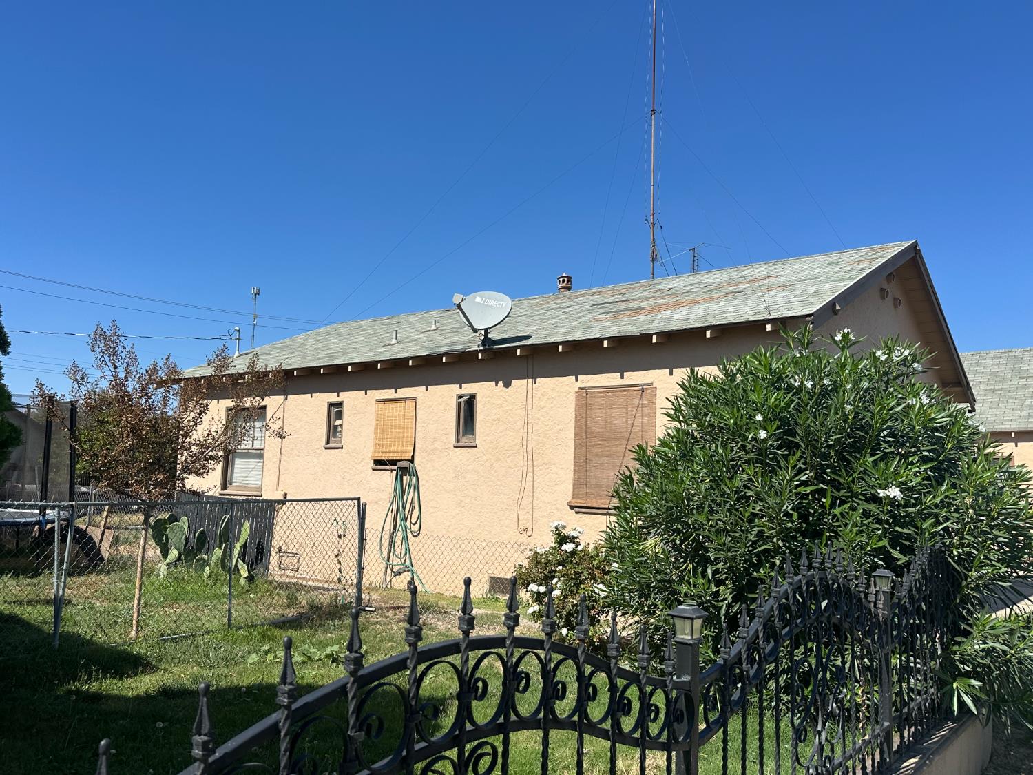 539 4th Street Gustine, CA 95322 - Photo 2 of 5 a backyard of a house with table and chairs