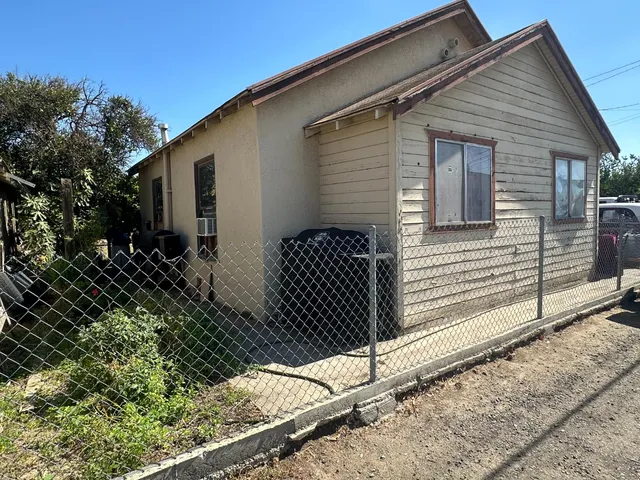 a front view of a house with garage