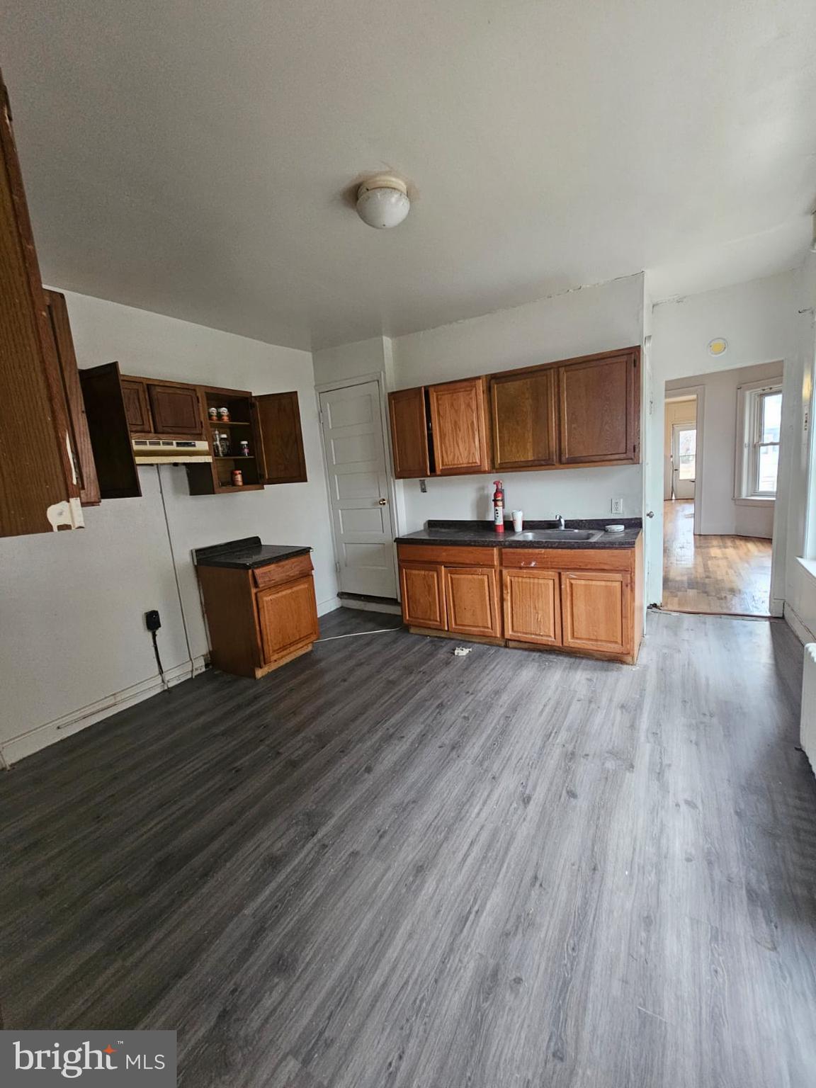 263 Highland Avenue Trenton, NJ 08618 - Photo 3 of 8 a room with wooden floor and furniture