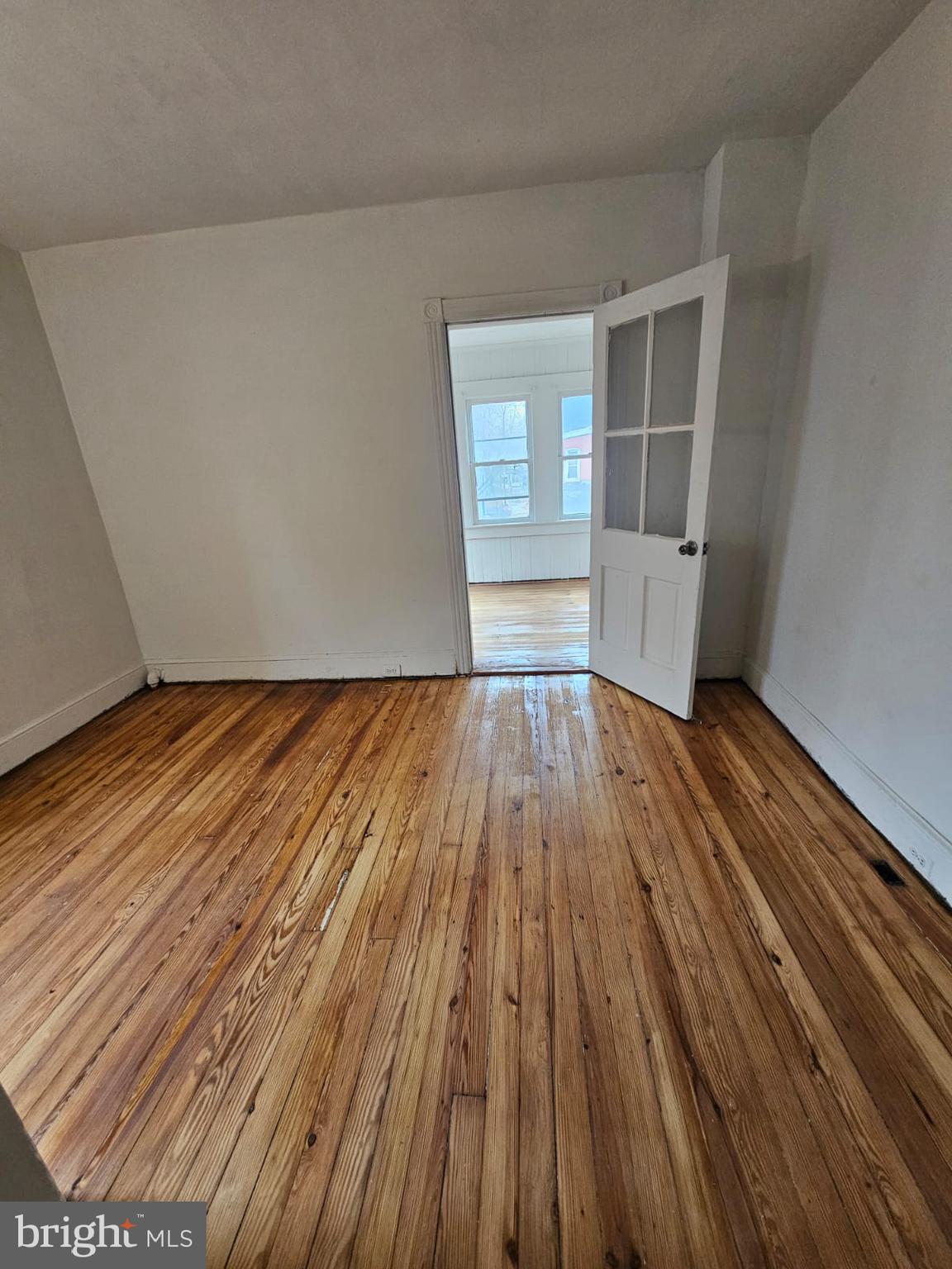 263 Highland Avenue Trenton, NJ 08618 - Photo 5 of 8 a view of wooden floor in an empty room