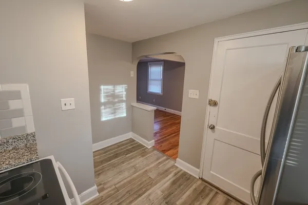a view of entryway with wooden floor and stairs