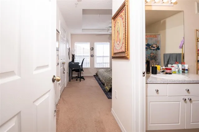 a bathroom with a sink toilet and shower curtain
