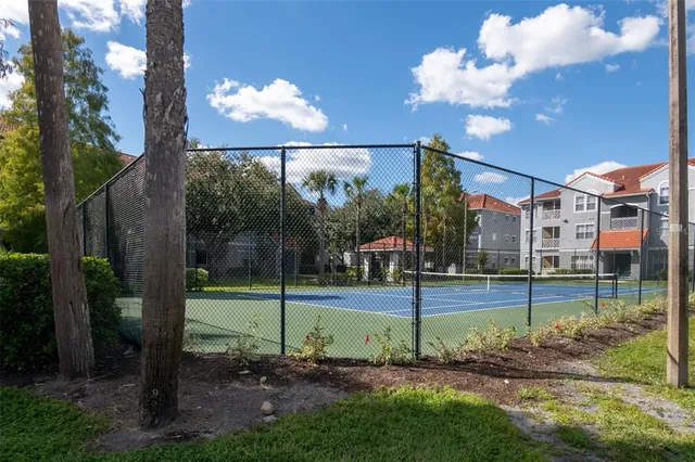 a view of a swimming pool with a table and chairs