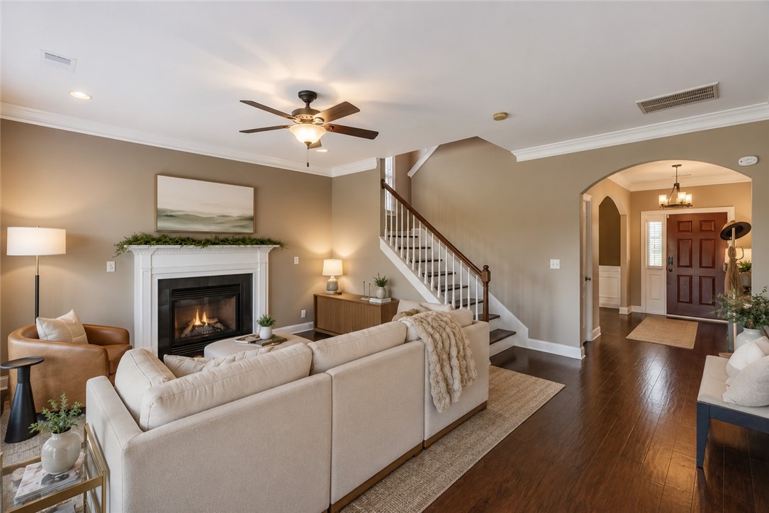 15 Fawn Hill Drive Anderson, SC 29621 - Photo 20 of 38 This inviting space features a cozy fireplace, hardwood floors, and a beautifully crafted staircase.
